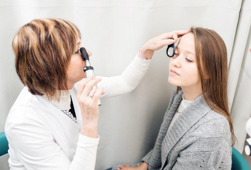 female-optometrist-examining-young-womans-eyes-in-clinic1
