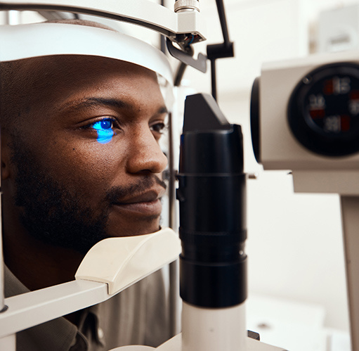 man taking eye disease scanning