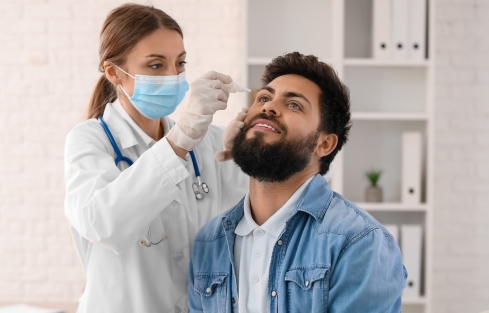 Man receiving dry eye treatment at Erkers in St. Louis