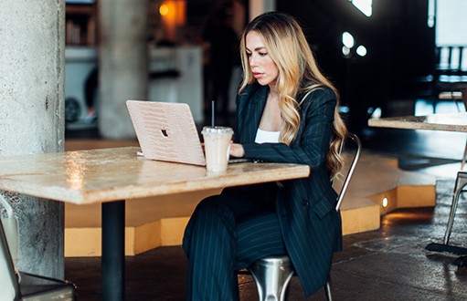 woman engaged in a task on her computer